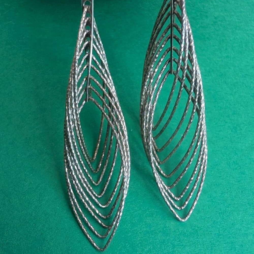 Silver interlocking hoop earrings with textured surface 2"